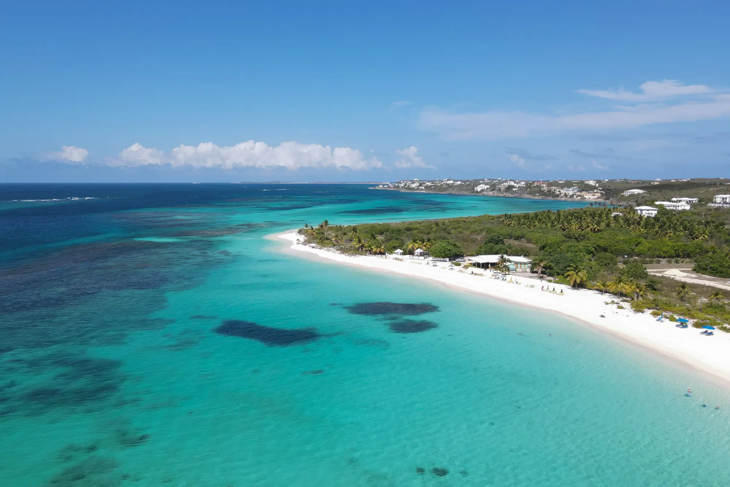 Aerial view of the turquoise water and white sand coastline at Shoal Bay East, Anguilla