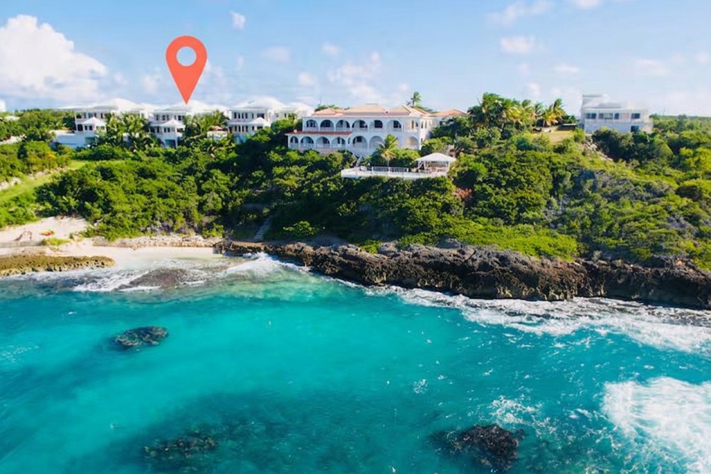 Aerial view of the Shoal Bay East coastline and villas above the Atlantic in Anguilla