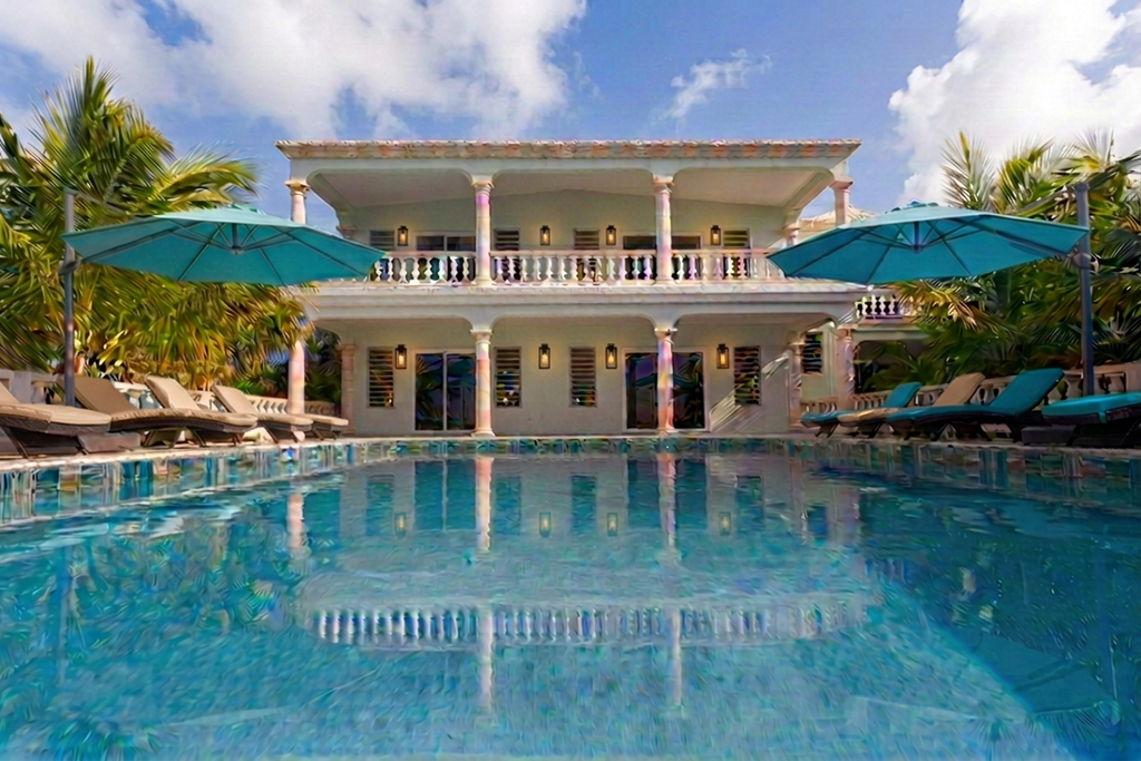 Balcony view over the pool deck's turquoise umbrellas to the Atlantic
